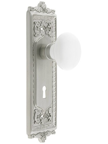 Egg and Dart Style Mortise Lock Set with White Porcelain Door Knobs in Satin Nickel.